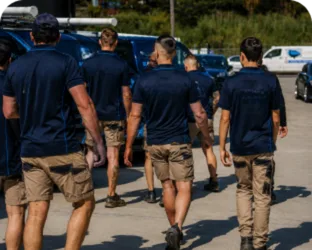 Plumbers walking to their service vans on a Lindfield job